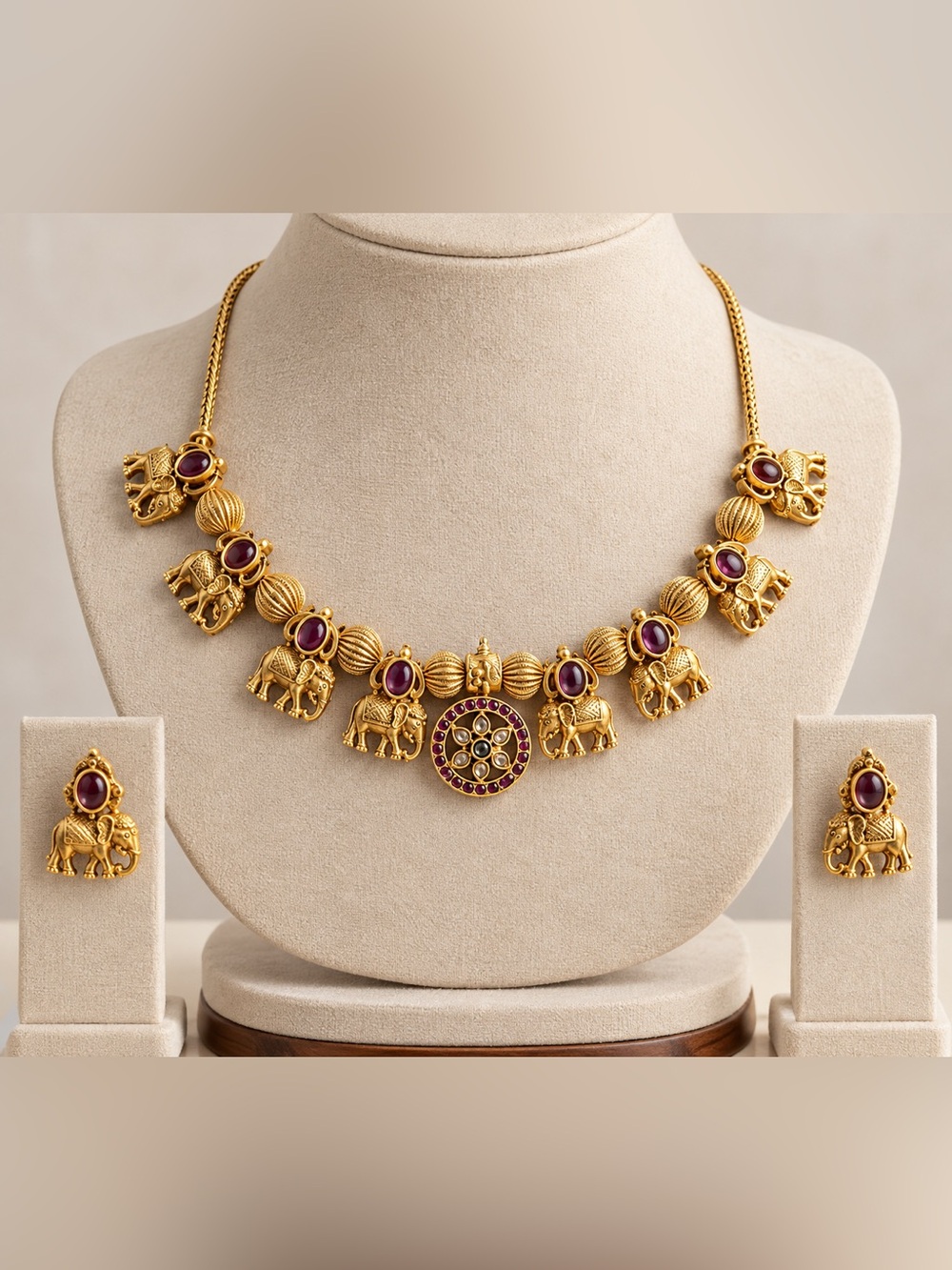 Gold Elephant Charm Necklace with Purple Gem Accents